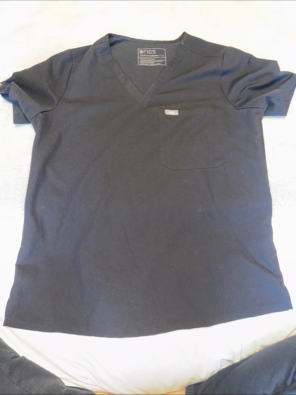 Figs Woman’s Black V-Neck Scrub Top with Chest Pocket